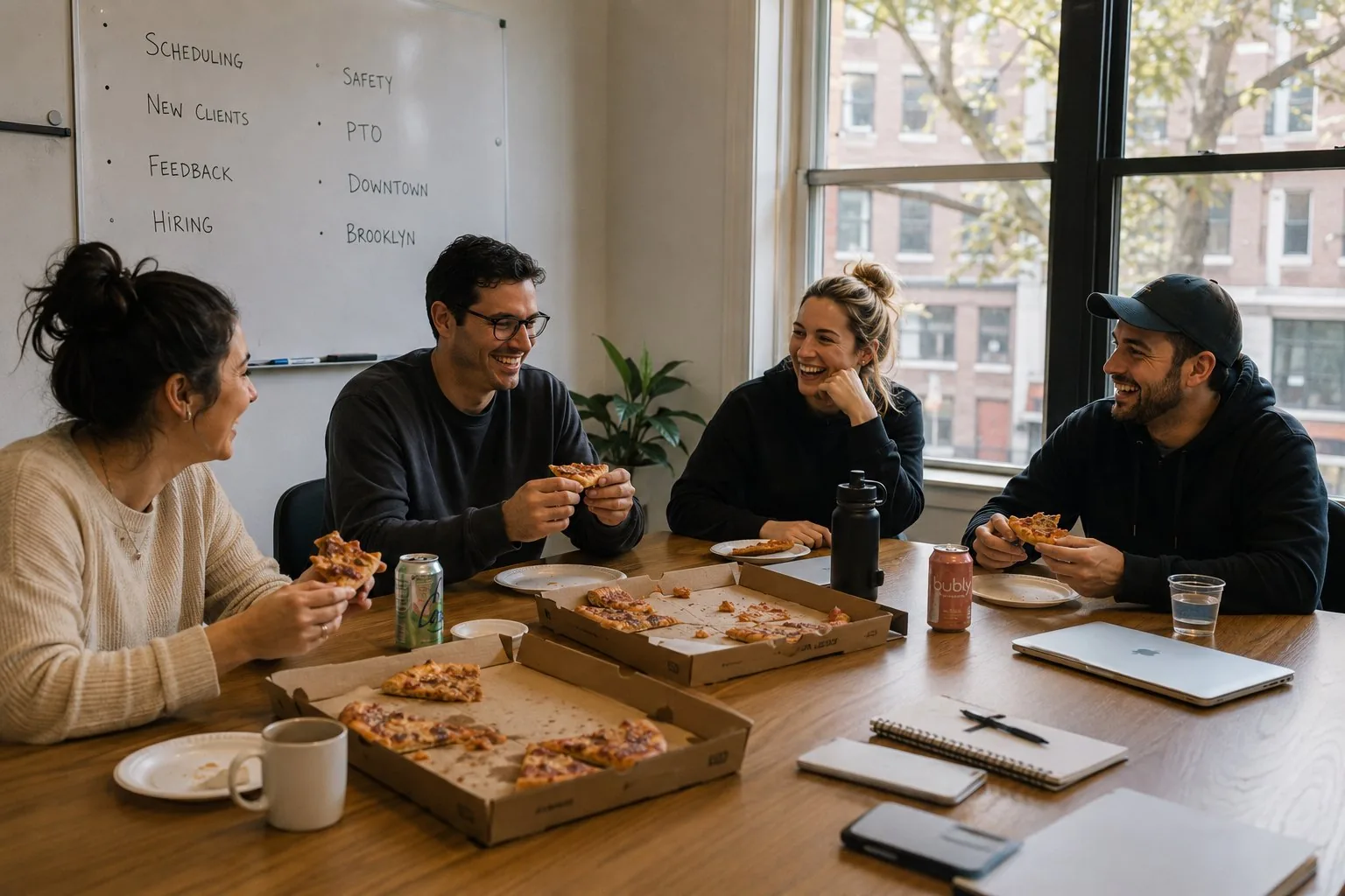 The Houndry team laughing together over lunch